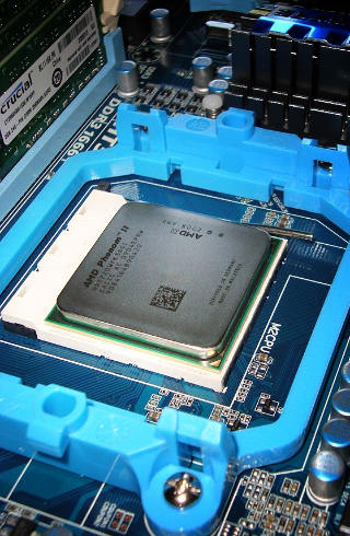 Phenom II CPU in socket, closeup at an angle